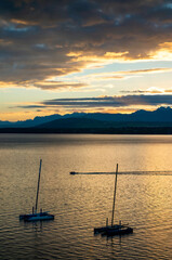 sunset with sailboat on the Geneva lake, Switzerland