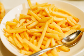 A plate of french fries. favorite fast food food.