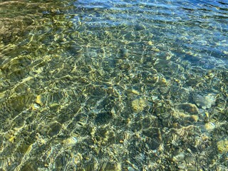 Sea water pebbles stones clear transparent seabed