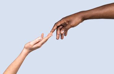World unity and racial love and races. Hand skin colors touch two. Woman and African American man...