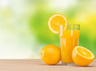 Fresh sweet orange juice in glass on table