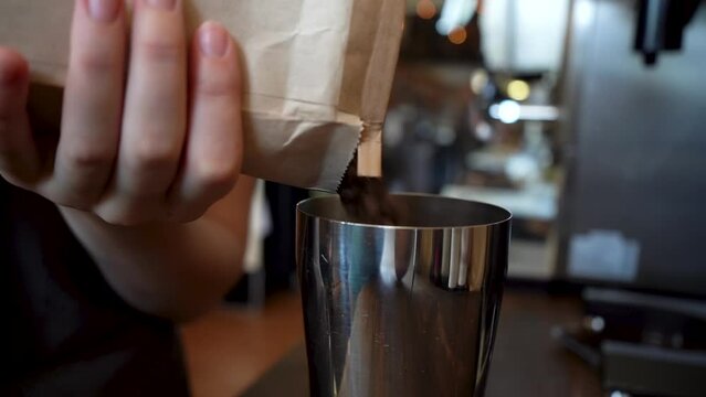 Coffee beans being poured into a container