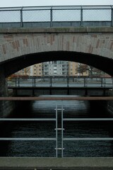 Fototapeta premium Stone bridge over the river at daytime