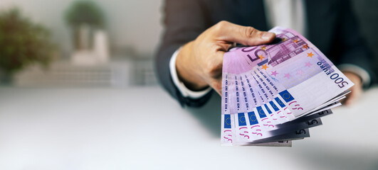 hand with 500 euro banknotes. bank money loan, consumer credit and quick loans. banner with copy space - obrazy, fototapety, plakaty