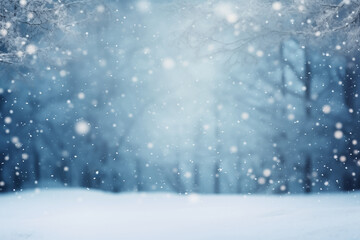 Naklejka na ściany i meble winter blurred background with snowfall on the background of trees