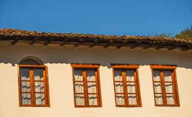 View of a old house with wooden windows in Berat Albania. The old houses of Berat in Albania. Historic city of Albania