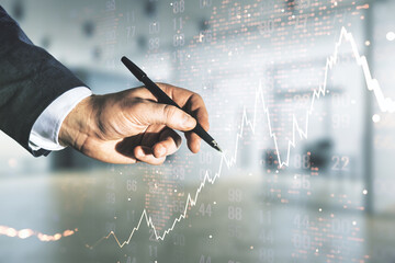 Multi exposure of trader hand with pen working with virtual abstract financial chart and world map on blurred office background, research and analytics concept