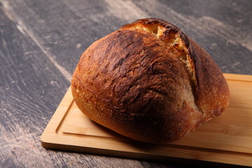 fresh round bread on a board