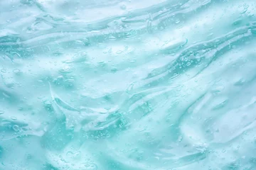 Fotobehang Transparent clear blue liquid serum gel cosmetic texture background © Piman Khrutmuang