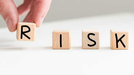 RISK - the inscription on wooden cubes on a white background