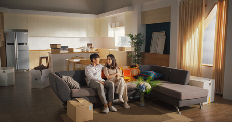 Family Home Moving in: Happy and Excited Young Korean Couple Enter Newly Purchased Apartment....