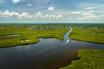 Aerial view of Florida wetlands with green vegetation between ocean water inlets. Natural habitat of many tropical species