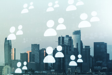 Fototapeta na wymiar Double exposure of social network icons hologram on Los Angeles office buildings background. Networking concept
