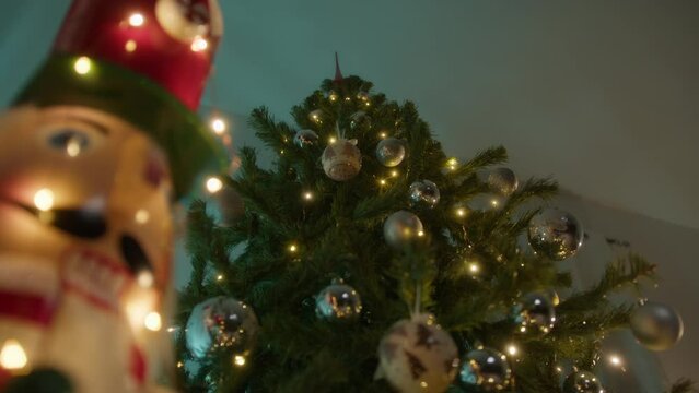 nutcracker with christmas tree and lights background 