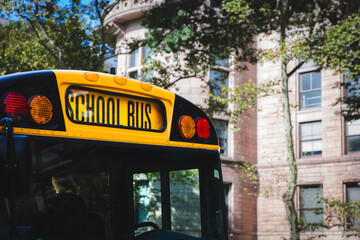 Close up of the front sign and lights of a typical American yellow school bus - obrazy, fototapety, plakaty