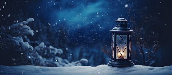  a lantern sitting on top of a pile of snow in front of a forest filled with lots of falling snow.
