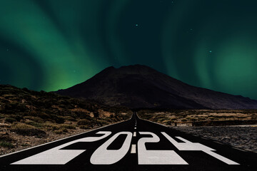 2024 New Year celebration on the asphalt road with a northern light as a background