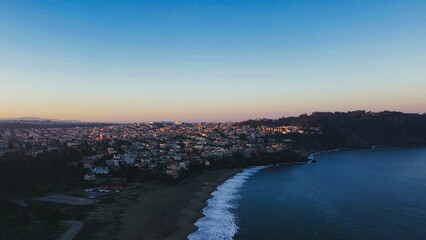 Scenic drone shot of residential buildings near the baker beach of San Francisco in California, USA