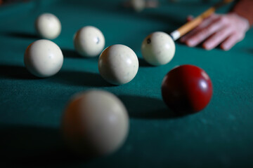 Russian billiard balls, cue, triangle, chalk on a table Green cloth Copy space