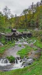 Fototapeta na wymiar Beautiful small woode watermills in the middle of the forest, Mlincic, Bosnia and Herzegovina