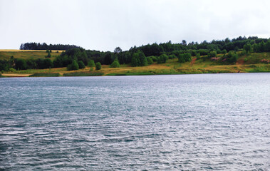 Water surface. The texture of the water. Waves on the lake in windy weather.