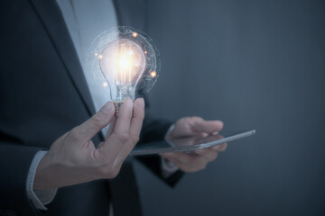Inspiration. hand hold light bulb for good idea. brainstorming creative. Idea innovation and...