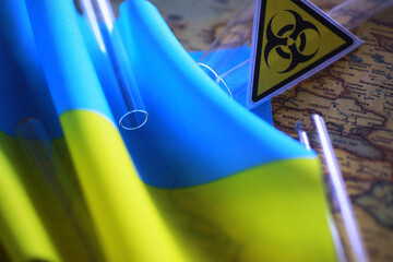 Ukrainian flag biohazard and test tubes. Assistance to Ukraine in biolaboratories. Western...