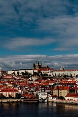 Obraz premium Vertical aerial view of a sunset sky over the skyline of Prague, Czech Republic