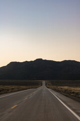 Driving towards the mountains during the sunset