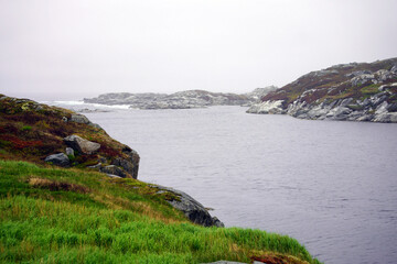 Fototapeta na wymiar Rocky inlet on a cloudy day on Newfoundland's south coast