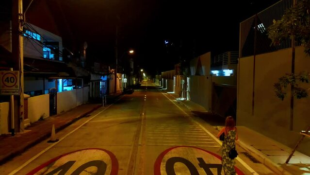 Drone footage. Night road in Pattaya, Thiland. Led lightson road between lines.