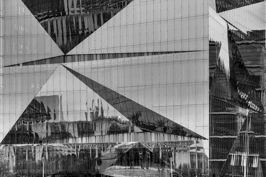 Berlin, Germany - October 12, 2023: Reflection of the German Chancellery (German: Kanzleramt) in a modern architecture glass facade.