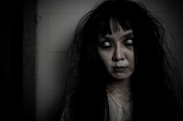 Portrait of asian woman make up ghost,Scary horror scene for background,Halloween festival concept,Ghost movies poster,angry spirit in the apartment