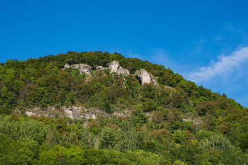 Fototapeta na wymiar View up to the summit of Houbirg near Happurg/Germany with its rock formations