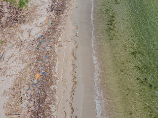 Fototapeta na wymiar Debris/plastics washed ashore, the environmental impact of this is large