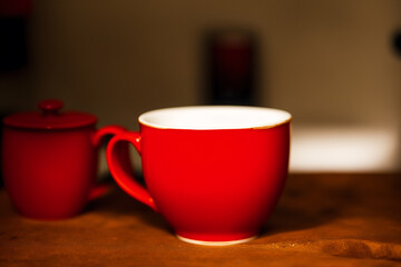Obraz na płótnie Canvas A red mug. Passionate Flames. The Fiery Red Mug. Generative AI