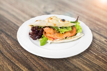 Tasty fresh sandwich with fish and vegetables
