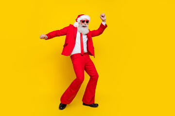 Full length photo of cool positive claus wear red tux costume having fun dancing disco empty space isolated yellow color background