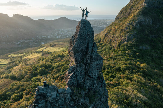 Aerial view of people climbing on Piton Jacob Peak mountain in Port Louis, Mauritius.