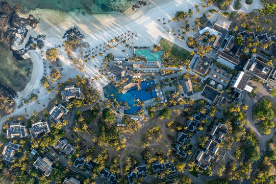 Aerial view of a luxury resort and hotel with swimming pool on the beach along the coastline, Long Beach, Poste de Flacq, Flacq district, Mauritius.