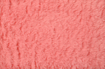 Pink fur background close-up. View from above.