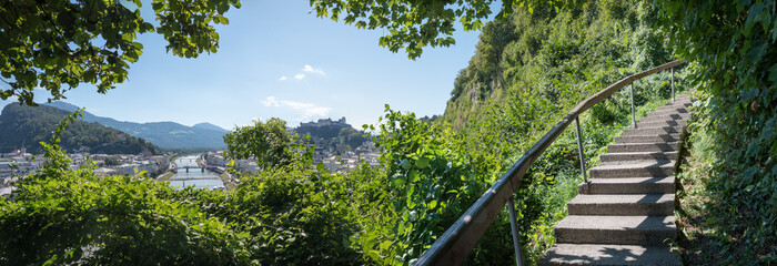 adventorous hiking route along Monchsberg, with staircase and view to fortress Hohensalzburg