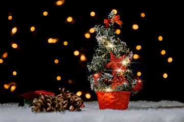 Christmas tree with red ornaments decoration and light. Christmas and new year concept. Bokeh light in the background.