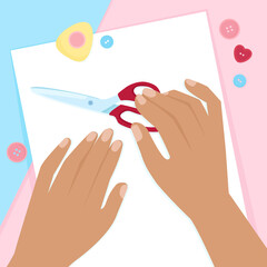 Two female hands and scissors on a background with sewing tools