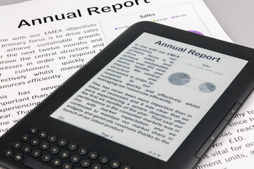 E-reader showing a company annual report with a printed copy