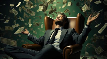 Fotobehang A businessman sits contented with his arms outstretched on a green sofa, US dollar bills falling from the top. © visoot