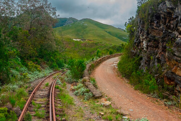 Where two passes meet. The Outeniqua railway pass is one of four passes which connected George to the hinterland. Here the railway pass passes the Montagu pass which was completed much earlier. - obrazy, fototapety, plakaty