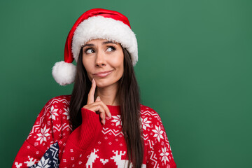 Portrait of minded pensive lady finger touch chin look empty space contemplate isolated on green color background