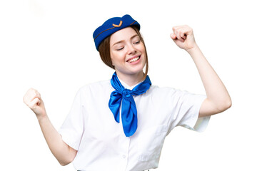 Airplane stewardess over isolated chroma key background celebrating a victory