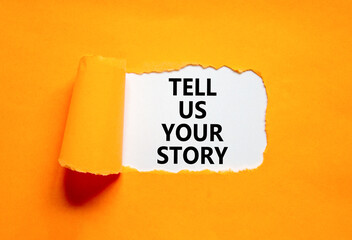 Tell us your story symbol. Concept word Tell us your story on beautiful white paper. Beautiful orange paper background. Business tell us your story concept. Copy space.